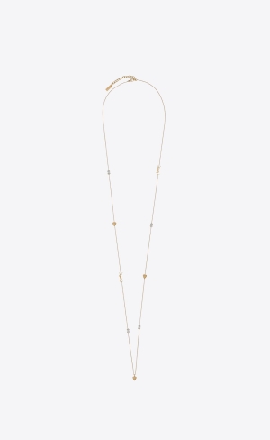 YSL Cassandre, Heart And Rhinestone Long Necklace In Metal Guld | FCE261835